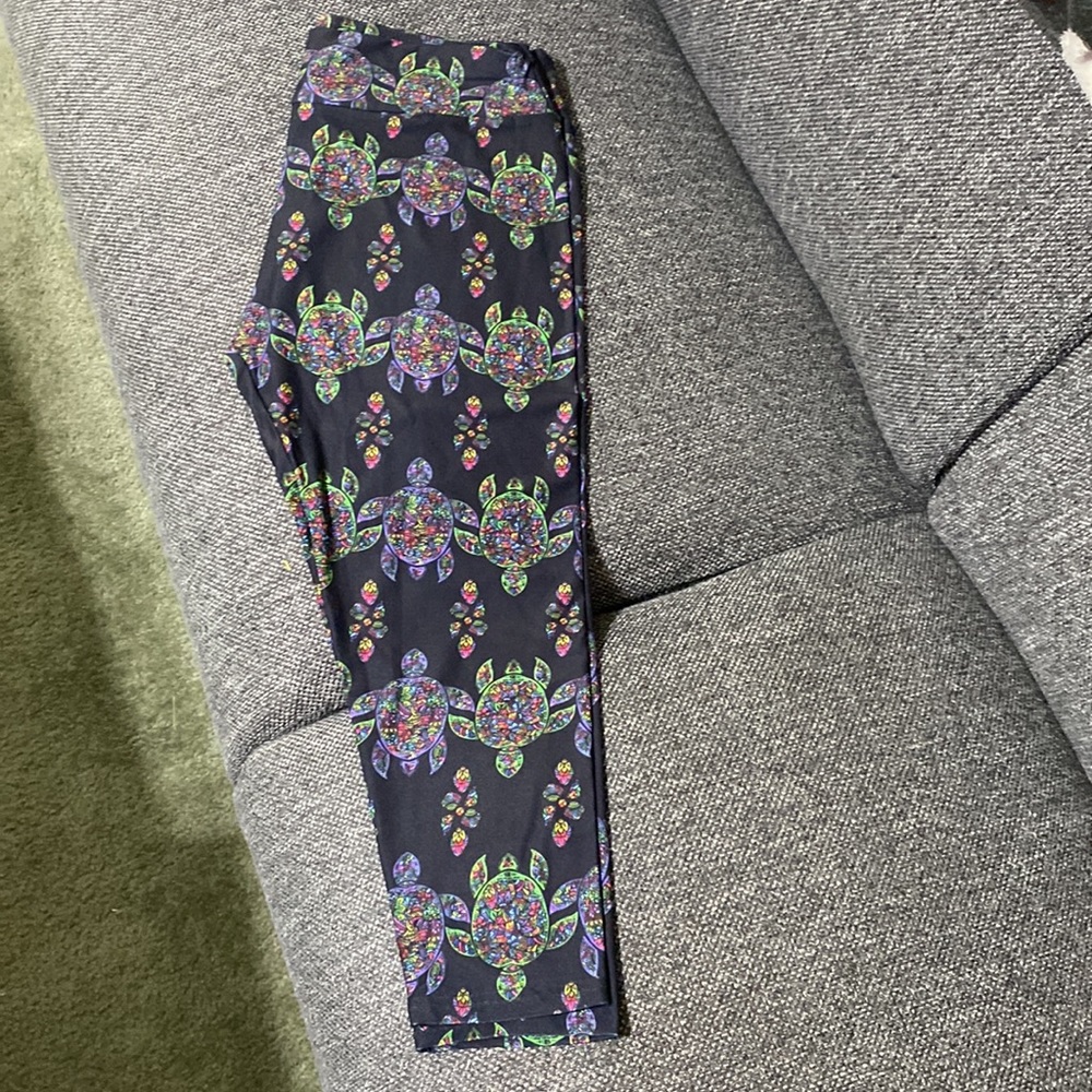 Black Capri pants with turtle print.
